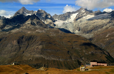 Landscape with mountain ranges with snow on the tops and mountain huts on a Mount Gornergrat, near...