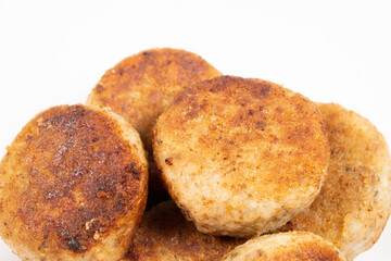 Fried homemade fish cutlets on a white background, close-up, recipe for fish cutlets.