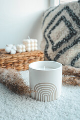 Candle in boho style in home interior
