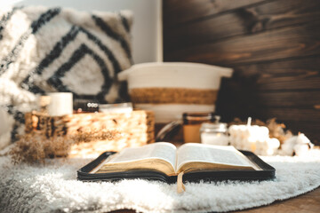 Fototapeta na wymiar Open Bible in the home interior