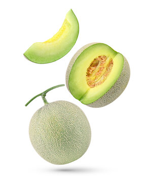 Whole and slices cantaloupe melon with seed falling in the air isolated on transparent background. PNG