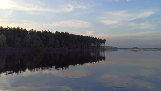 Beautiful landscape with evening Dnieper river with many trees and steep shore. Summer river surrounded by trees. Landscape with river flowing in forest. wide river Dnieper. largest Ukrainian river Dn
