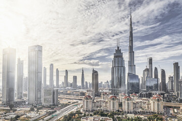 Fototapeta na wymiar DUBAI, UAE - CIRCA 2022: High key panorama of down town Dubai modern city on a cloudy day