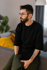 Fototapeta premium Sad man pondering about his life after a relationship breakup or bipolar disorder - depression asthenia , mental problem and anxiety disorder concept