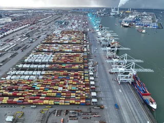 Foto op Canvas Rotterdam, 19th of January 2023, The Netherlands. Get a unique perspective of the busiest port in Europe with an awe-inspiring aerial drone photo. © Sepia100
