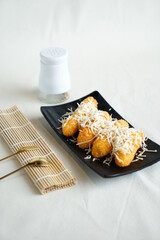 pisang Goreng Pasir or Pisang Crispy (fried banana) is made from sliced ​​four pieces of banana then covered with cheese