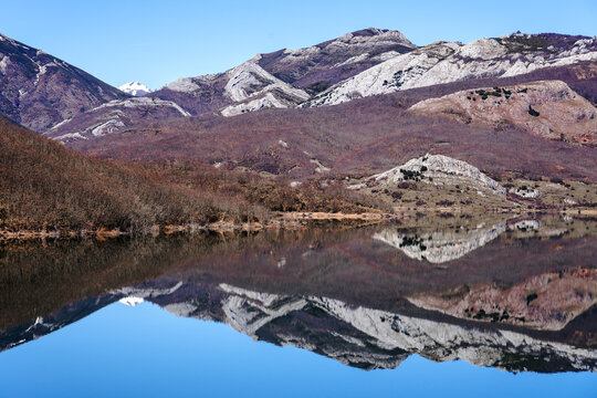 View since the Viewpoint of the porma reservoir, in the province of leon, on a sunny day with the Susar&oacute;n peak and mountains reflected in the water of the reservoir. Castilla y Leon, Spain.