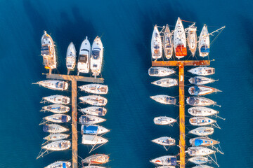 Aerial view of boats and luxure yachts in dock at sunset in summer in Pula, Croatia. Colorful...