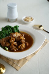 Ayam kecap or ayam masak kicap is an Indonesian Javanese chicken dish poached or simmered in sweet soy sauce. Commonly found in Indonesia, Malaysia and Singapore