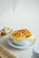 Grainy homemade creamy soup dish with corn potage and crisp puff pastry. Known as Zuppa Soup in Indonesia