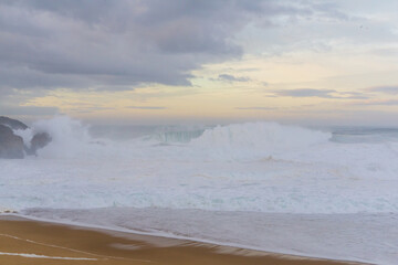 View from the cliff to the waves in Nazare