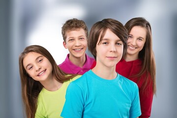 Happy group of young school students.