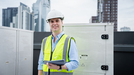 The engineer is inspecting the cooling tower air conditioner in a large industrial building to manage the airflow.