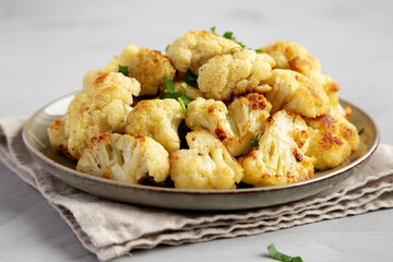 Homemade Roasted White Cauliflower on a Plate, side view.