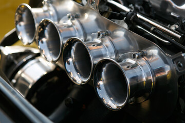 Classic car caburetor in close up. Tuner vehicle engine
