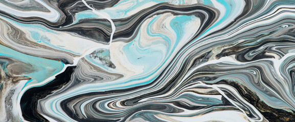 Imitation marble liquid ink. Fluid art background with light blue tints on white surface. Abstract marbling effect of acrylic paints on canvas. Magic texture with mixing colors. Modern interior design