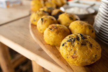 Polenta with aged fermented sheep cheese inside represents a traditional romanian food