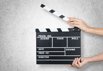 Classic movie clapperboard on wall background
