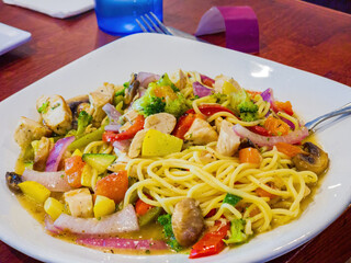 Close up shot of chicken pasta with sauce