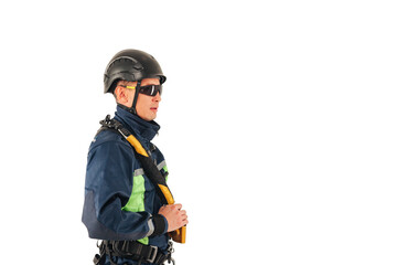 Obraz na płótnie Canvas Industrial mountaineering worker in uniform and sunglasses on white empty isolated background, looking away. Rope access laborer posing. Concept of industry urban works. Copy text space advertising