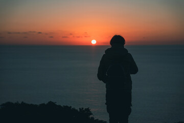 silhouette of a girl at sunset