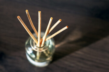 An aroma diffuser with aromatic oil and sticks in the room creates an atmosphere of peace and comfort