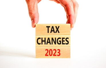 Tax changes 2023 symbol. Concept words Tax changes 2023 on wooden blocks on a beautiful white table...