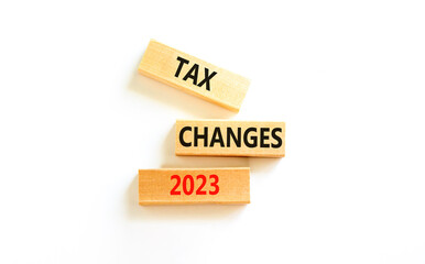 Tax changes 2023 symbol. Concept words Tax changes 2023 on wooden blocks on a beautiful white table white background. Business Tax changes 2023 concept. Copy space.