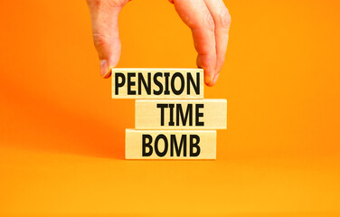 Pension time bomb symbol. Concept words Pension time bomb on wooden blocks on a beautiful orange table orange background. Businessman hand. Business pension time bomb concept. Copy space.