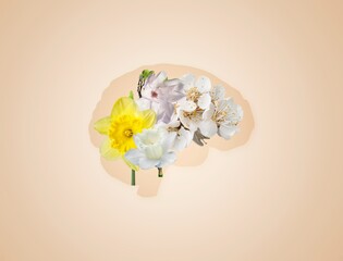 Mental health concept. Image of Brain with fresh flowers