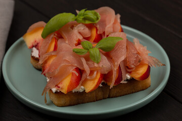 Toast with prosciutto and peach
