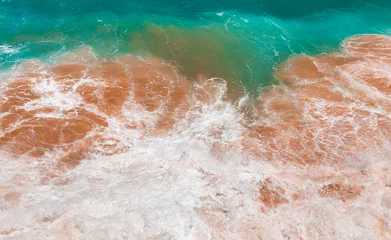 Foto auf Acrylglas Aqua beach water mixed with brown tones of the sand background from puerto rico © emaotx