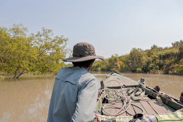 Traveling around the Sundarbans canal by boat.Sundarbans is the biggest natural mangrove forest in the world, located between Bangladesh and India.