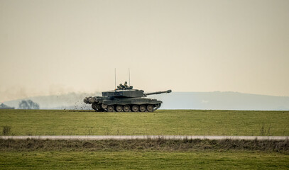 close-up of a British army FV4034 Challenger 2 ii main battle tank in action on a military combat...