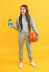 amazed teen basketball girl isolated on yellow. teen basketball girl in studio.
