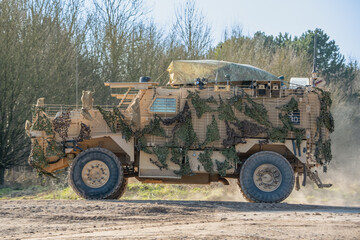 close-up side profile of a British army Ridgback 4x4, 4-wheel drive protected patrol vehicle on a...