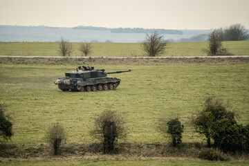 Naklejka premium close-up of a British army FV4034 Challenger 2 ii main battle tank in action on a military combat exercise, Wiltshire UK
