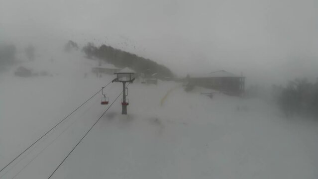 Shot from the drone of the funicular to the Himba mountain. Ski resort Pylypets in the Carpathians of Ukraine. Prepared tracks for skiers and snowboarders. The longest ski run in Ukraine. Cableway