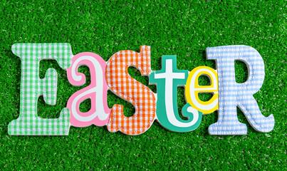 Easter wooden letters on a faux grass