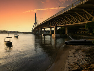 Sunset with the cable-stayed bridge Jorge Amado in the background in Ilheus, Bahia, Brazil
