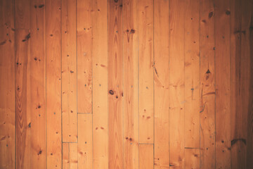 Dark wooden background from weathered vertical planks. Old hardwood surface with scratch and scar.