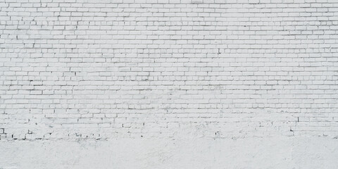 Empty big white brick wall with copy space outdoor. Abstract background of white brickwall.