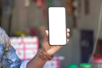 a man show his own mobile phone and the background is blurred