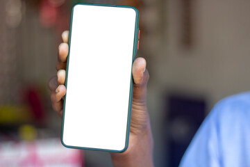 a man show his own mobile phone and the background is blurred