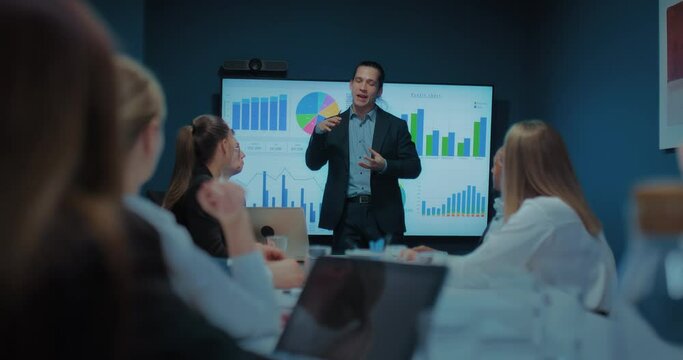 multi ethnic business team meeting in office and listening to financial analyst man, 4K, Prores