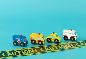 Wood sings: police, ambulance, taxi, and school bus on blue background isolated. Symbols: wood toys for kids. Caution sign.