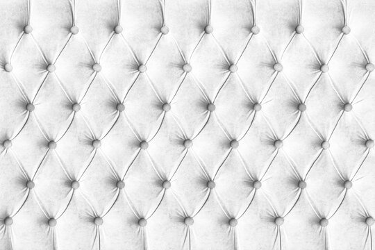 White capitone checkered soft fabric textile decorative background with buttons. Classic retro Chesterfield style, luxurious upholstery buttoned texture for furniture, wall, headboard, sofa, couch
