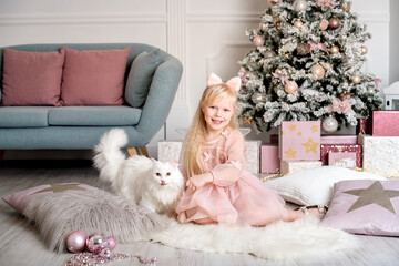 Child and Cat Enjoying Christmas Time