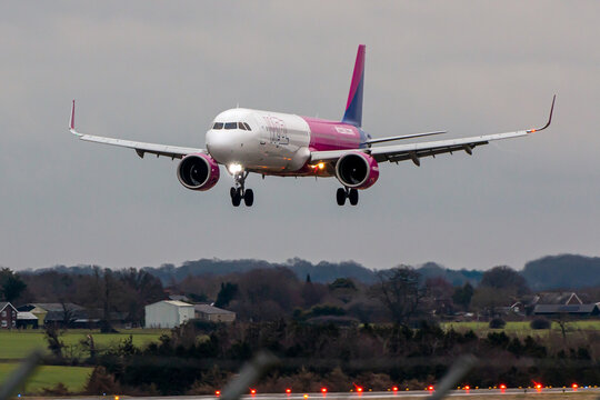 Luton, UK - February 12, 2023:  Low cost Hungarian Airline Wizzair plane approaching to London Luton Airport