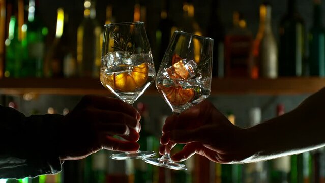 Super Slow Motion Shot of Clinking Two Glasses of Drinks. Filmed on high speed cinematic camera at 1000fps